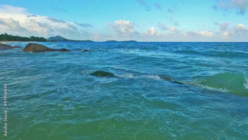 Aerial view of amazing beautiful island in Thailand. Clear water and waves.