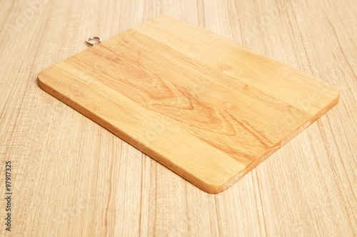 Empty cutting board on planks food background concept