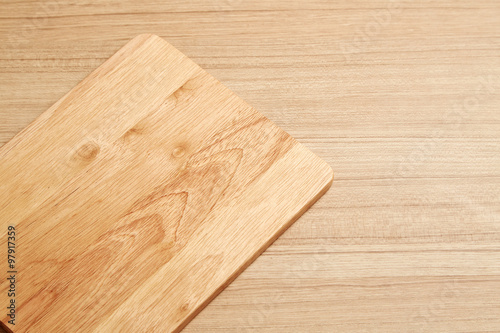 Empty cutting board on planks food background concept
