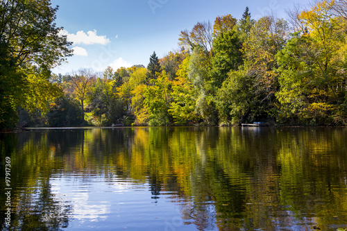 Fototapeta Naklejka Na Ścianę i Meble -  Reflective Still Pond in Autumn