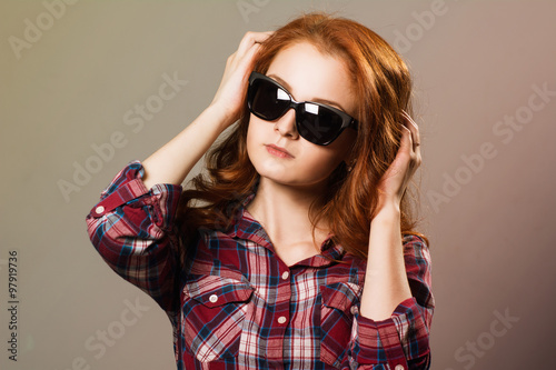 Portrait of a pensive girl in sunglasses