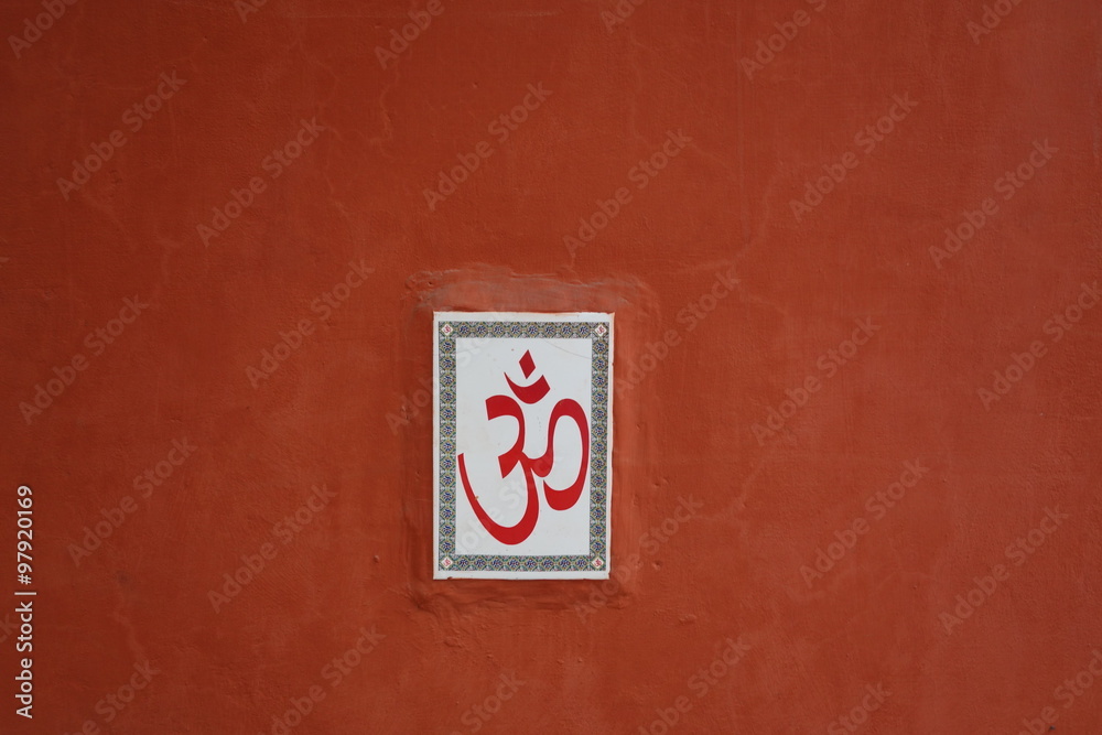 Terracotta wall with Hindu Om symbol, India Terracotta wall with Hindu Om symbol, India