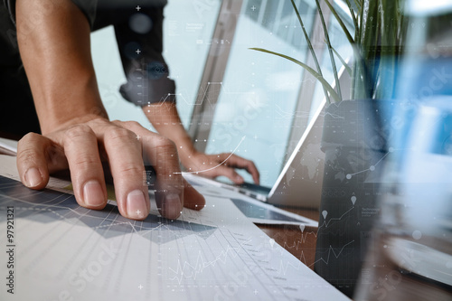 businessman hand working with new modern computer and business s