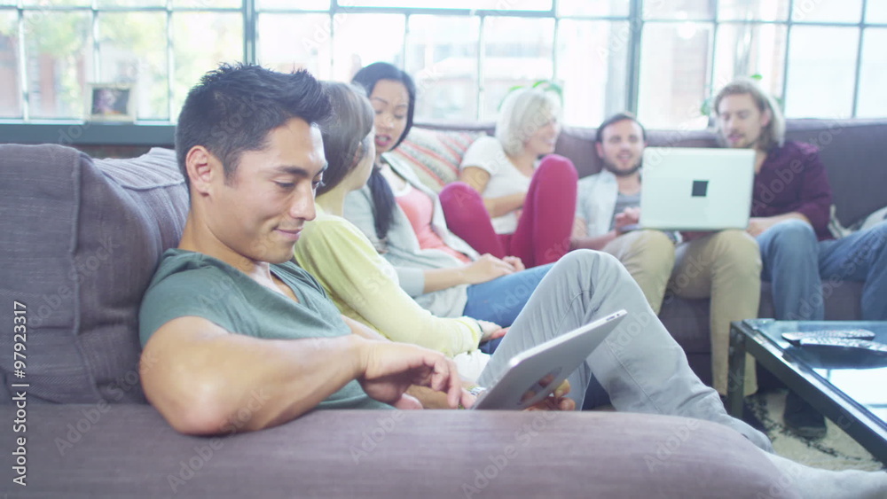 Attractive people socialise together whilst using technology Attractive people socialise together whilst using technology