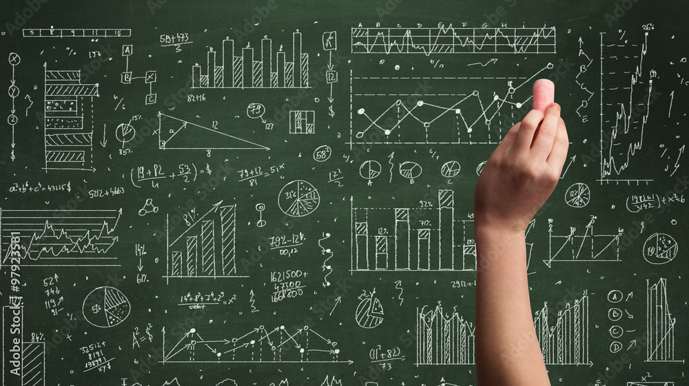 A business person drawing data on chalkboard A business person drawing data on chalkboard