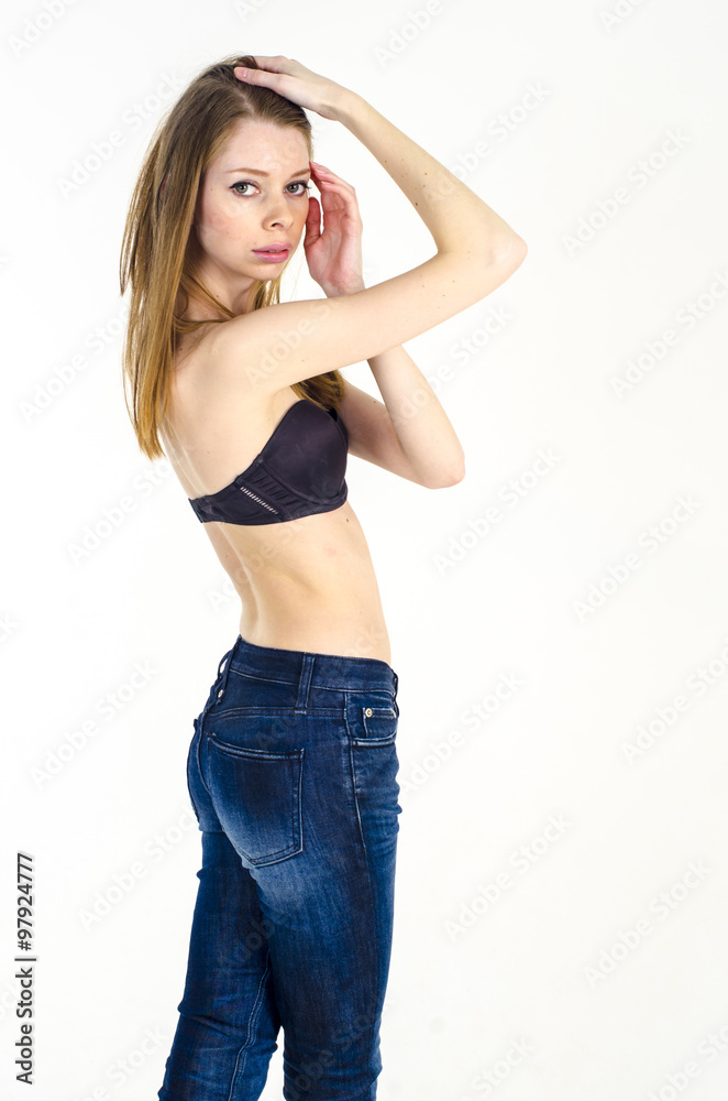 Slim blonde girl in jeans and bra Stock Photo | Adobe Stock