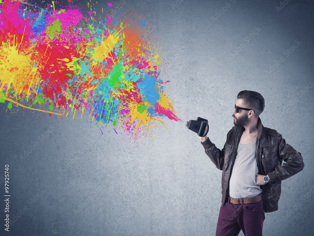 Hipster guy with camera and paint splash Hipster guy with camera and paint splash