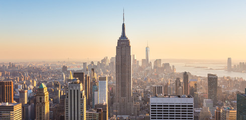 Wandcirkels Empire State Building Manhattan skyline tijdens kleurrijke zonsondergang  © kasto