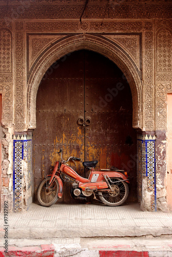 Old motorbike near the ancient Moroccan gate, Marrakesh