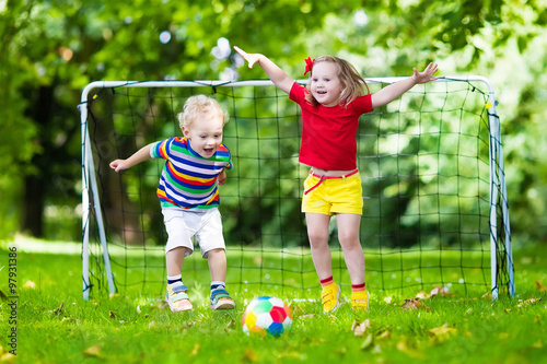 Kids playing football in school yard photo