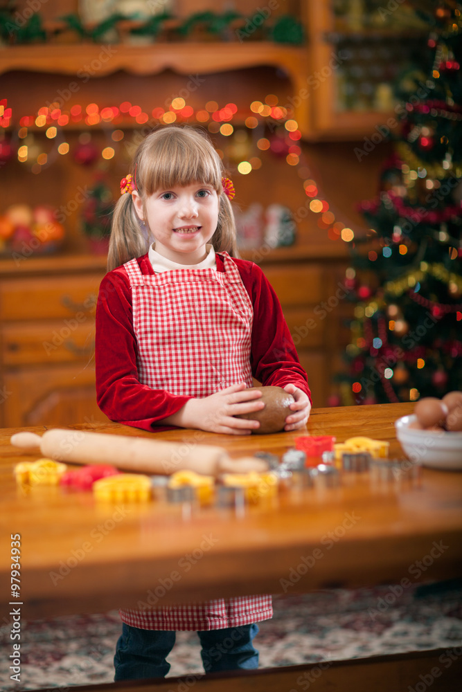 Little girl preparing Christmas cookies