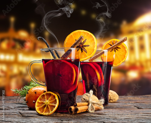 Hot red wine drinks on wooden table