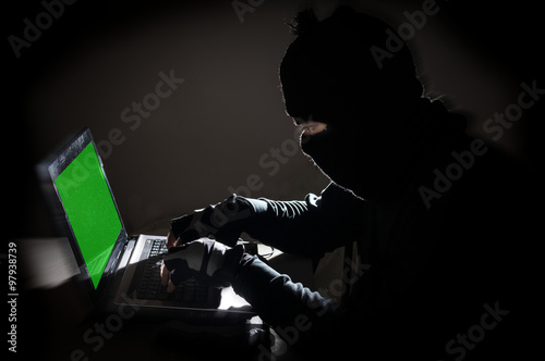 Robber man hacking computer
