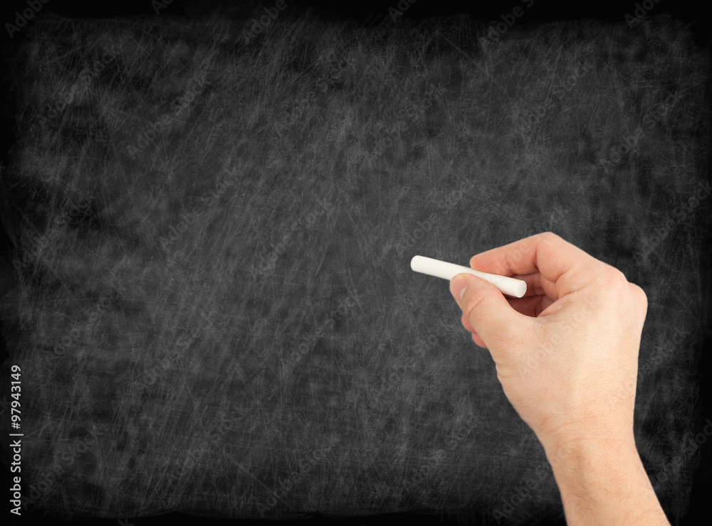 Naklejka premium hand writing by white chalk on a blackboard. Useful as backgroun