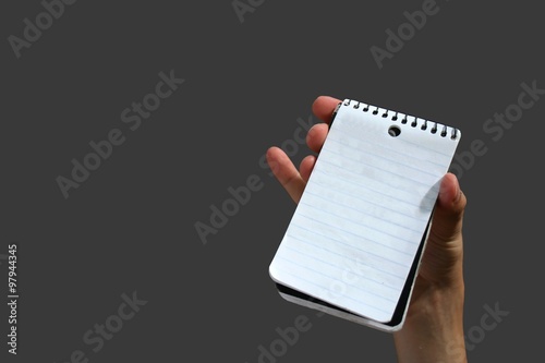 Isolated hand holding empty notepad
