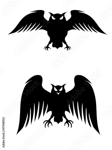 Flying owls. Stylized logo silhouettes. Vector eps8 isolated on