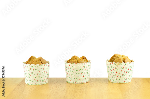 sweet muffins decorate on wood table in white background