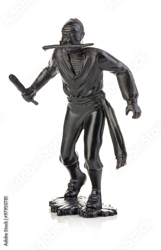 Angry pirate with a knife in his hand close-up isolated on white . Miniature figurine of a children's toy.