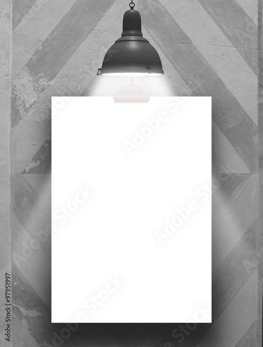 One hanged paper sheet frame with black retro lamp on fresco plastered wall background