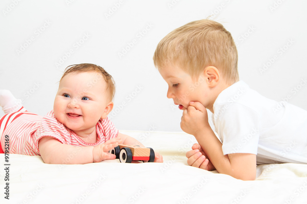 little girl and boy playing with toys little girl and boy playing with toys