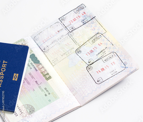 a passport with pages with visas and stamps