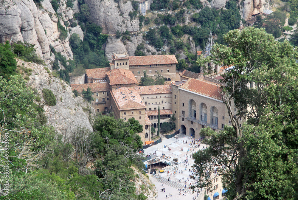 MONTSERRAT, SPAIN - AUGUST 28, 2012: Benedictine abbey Santa Maria de Montserrat in Monistrol de Montserrat, Spain. View from the funicular de Sant Joan