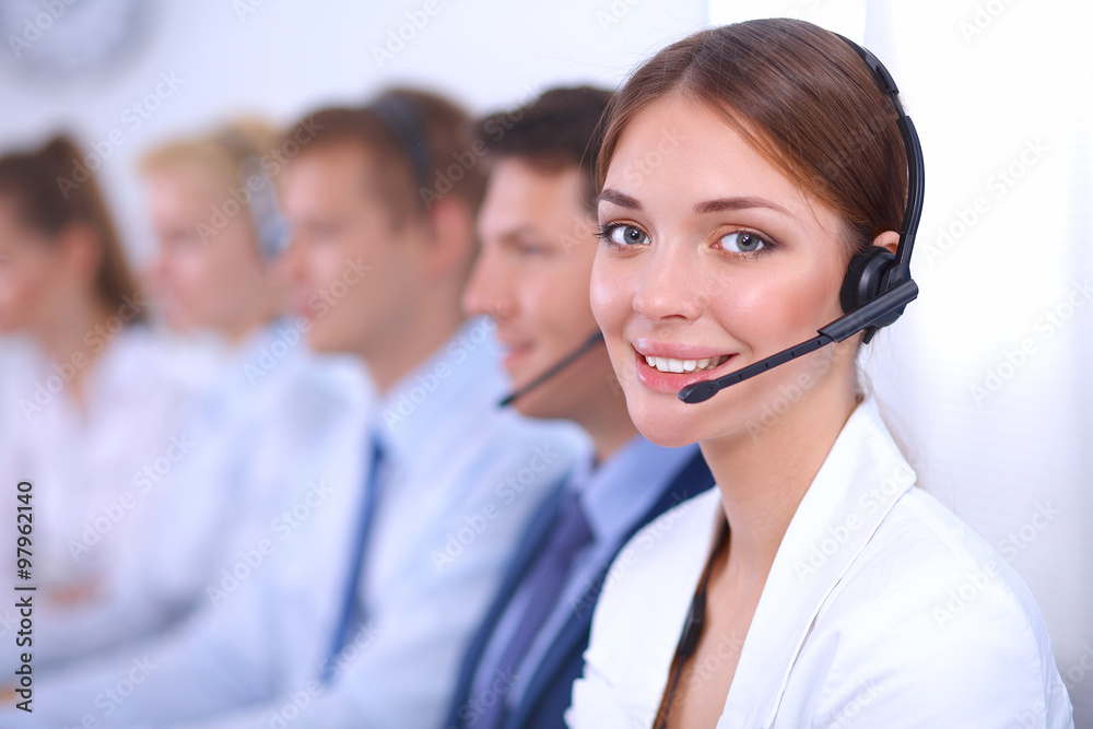 Attractive Smiling positive young businesspeople and colleagues in a call center office Attractive Smiling positive young businesspeople and colleagues in a call center office