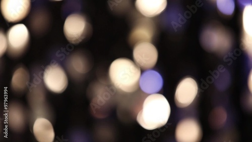 Abstract glittering lights, silver background, a real shot video in the blur