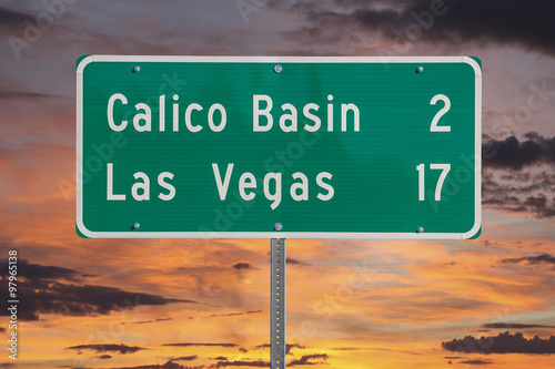 Las Vegas Highway Sign with Sunset Sky