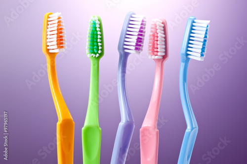 a group of colorful toothbrushes