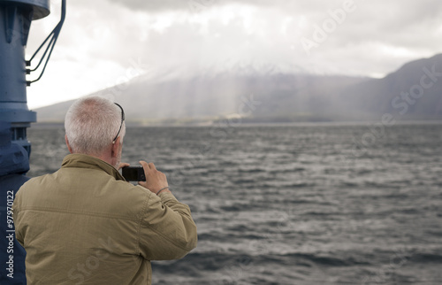 a man taking picture of Fuji mountain