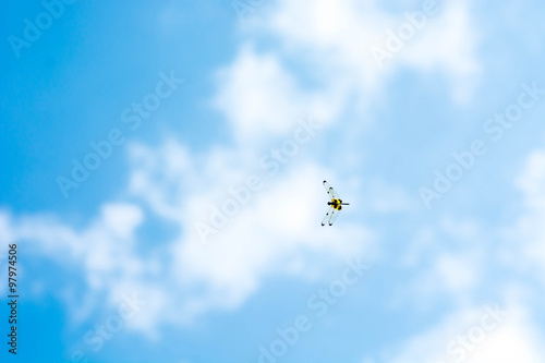 dragonfly flying on blue sky(Rhyothemis phyllis)