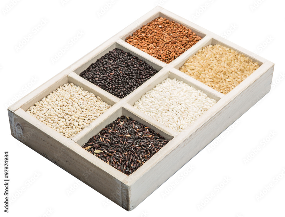Rice and millet grains assortment in white box over white background Rice and millet grains assortment in white box over white background