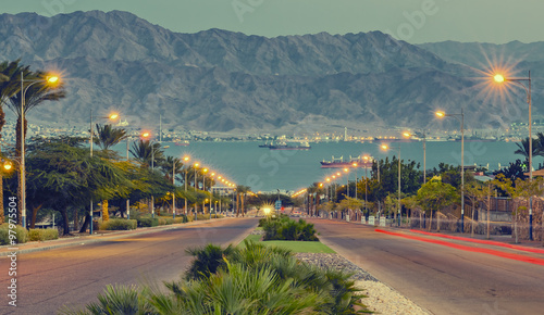 View on the Red Sea from a local street in Eilat after sunset, Israel. Image ...