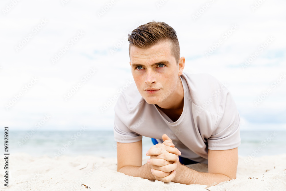 Man training on beach outside Man training on beach outside