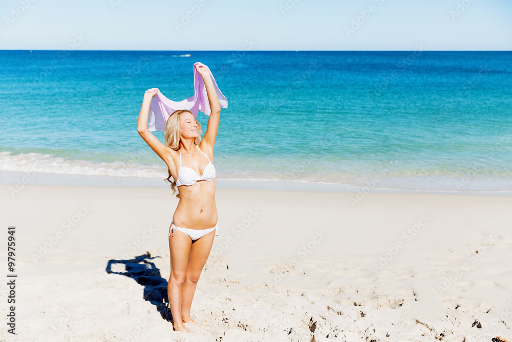 Young woman relaxing on the beach Young woman relaxing on the beach