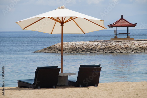 Chairs and Umbrealla on a Beautiful beach   © buladeviagens