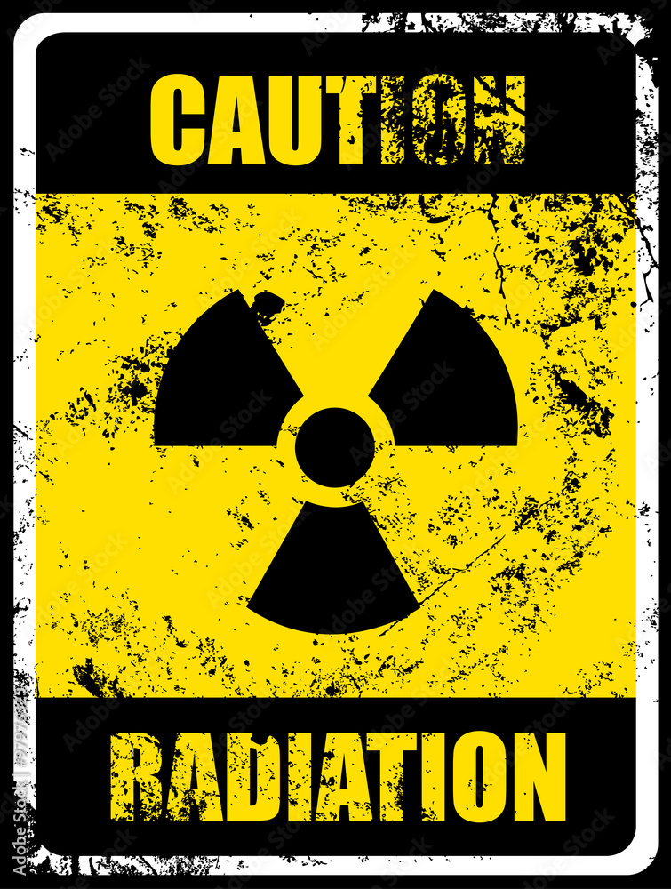 Obraz premium Caution Radiation Sign and Grunge Texture