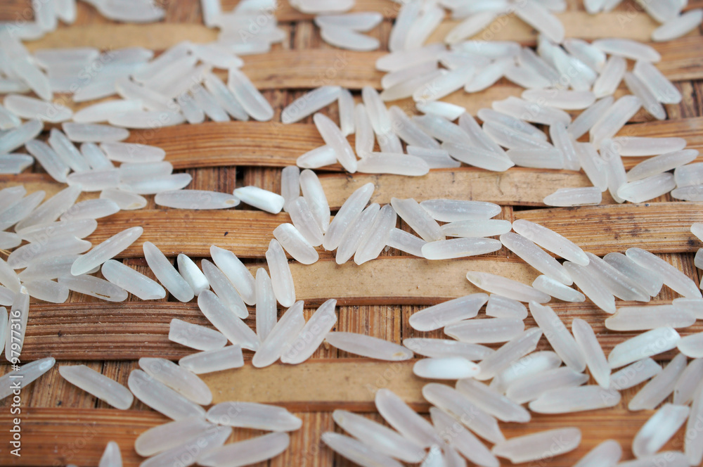 jasmine rice grain on native style banboo wall. jasmine rice grain on native style banboo wall.