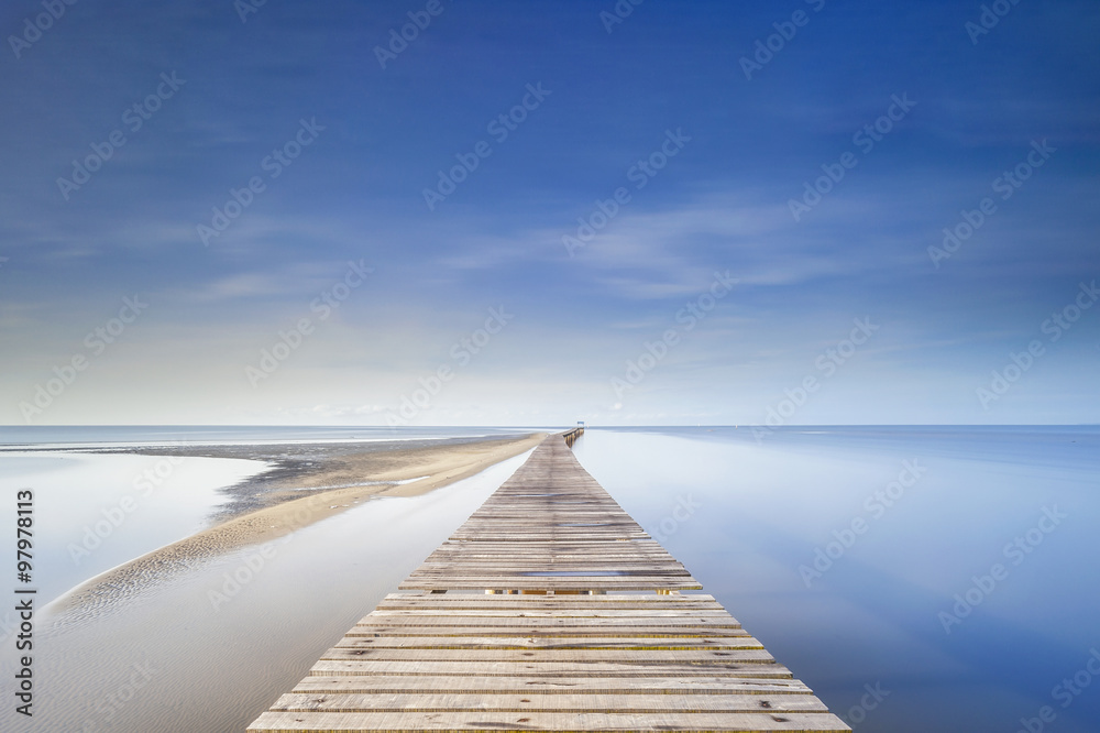 Long wooden jetty during morning