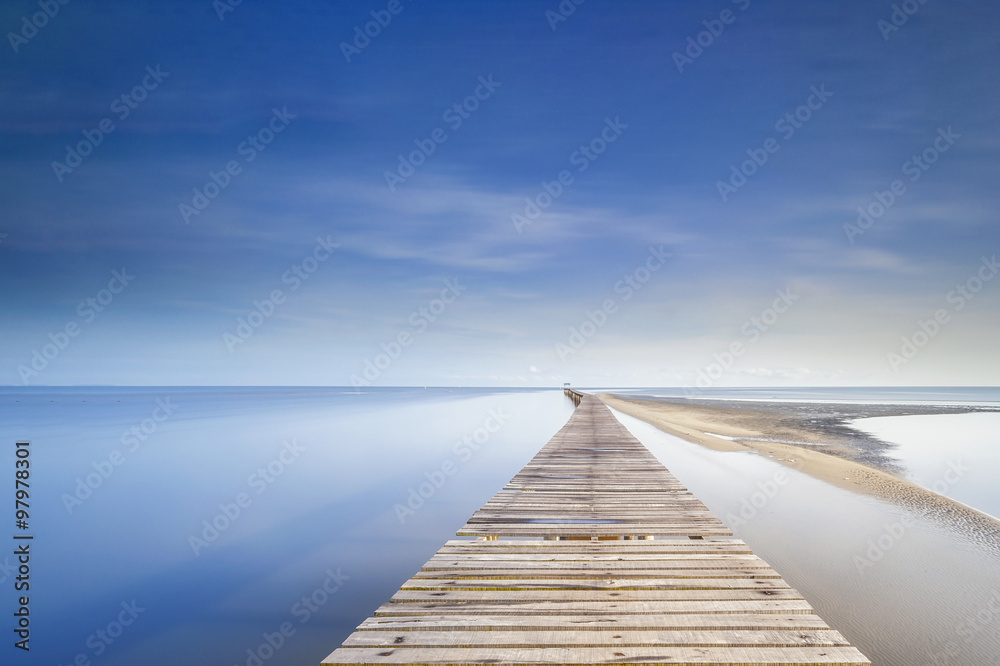 Long wooden jetty during morning