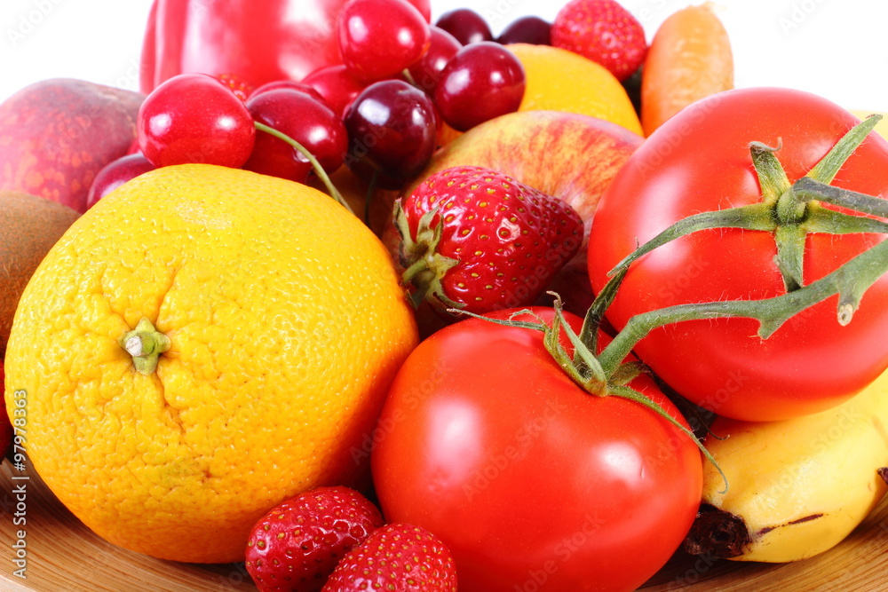 Fresh fruits and vegetables on wooden plate Fresh fruits and vegetables on wooden plate