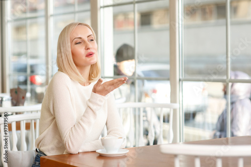 Charming woman sitting in the cafe  photo