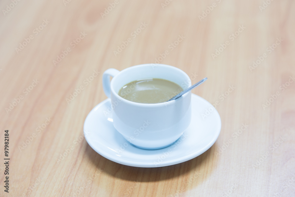 Coffee cup on a wooden table Coffee cup on a wooden table