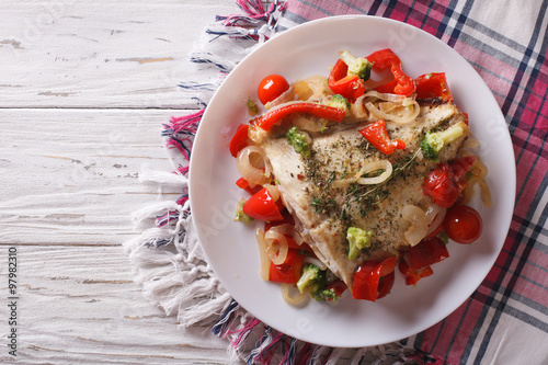 baked flounder with seasonal vegetables. horizontal top view
 photo