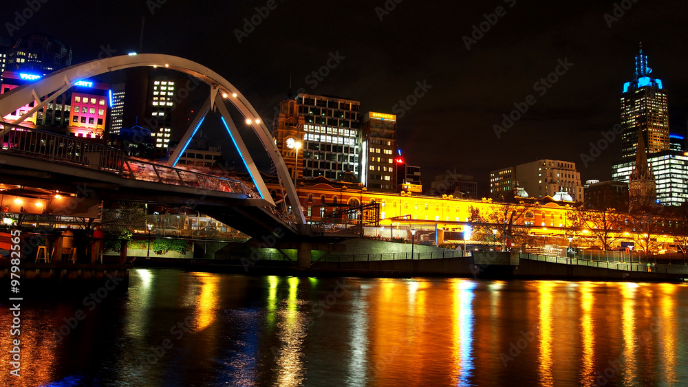 Bridge across the yarra river at night in Melbourne city, Australia