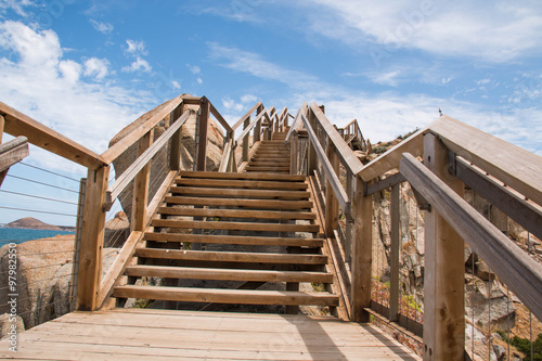 Wood bridge on granite rock and sky with and sky