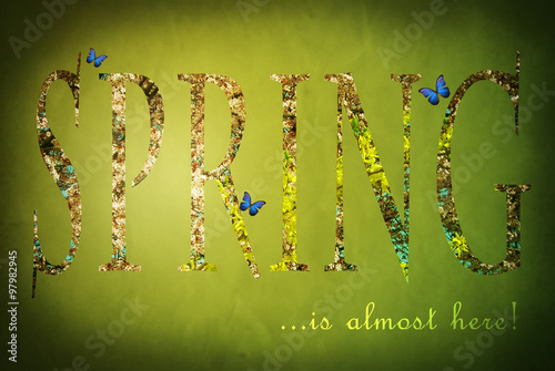 Green spring illustration with the flower-patterned text "Spring is almost here" on the grungy background with dark vignette.