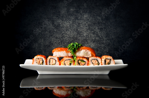Sushi and rolls in plate