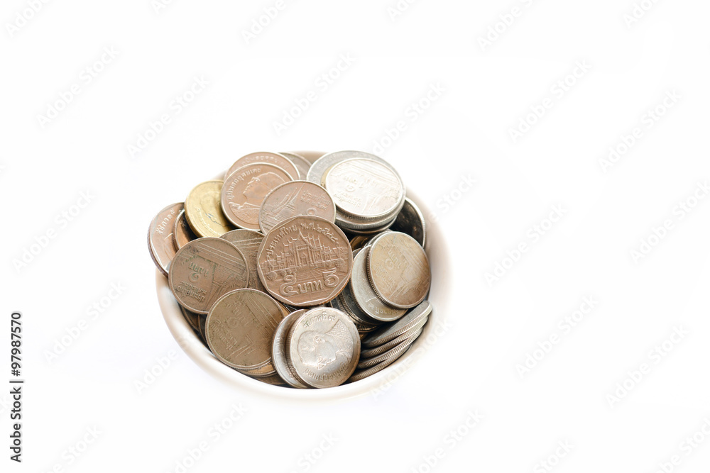 Saving money concept ,putting coins in a cup on a wooden floor. Saving money concept ,putting coins in a cup on a wooden floor.